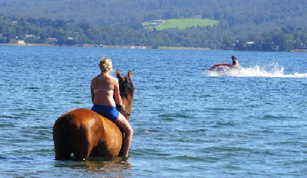 She loves soaking her leg at the beach